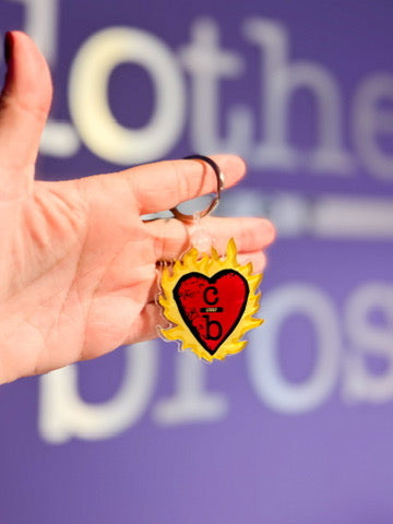 Flaming Clothes Over Bros Keychain